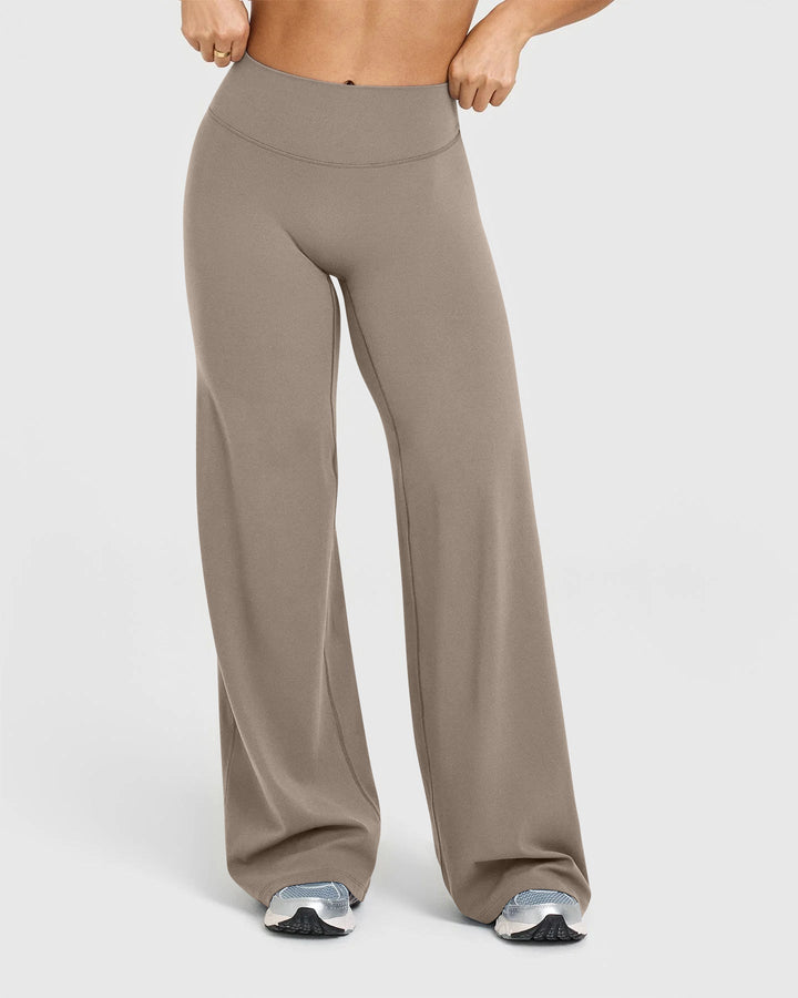 Sorvienne Relaxed High Waisted Flared Leggings in Taupe