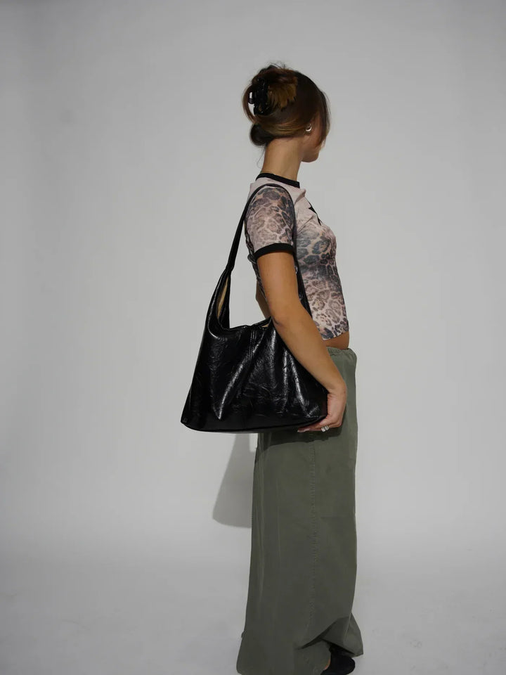 Sorvienne Slouchy Glossy Faux Leather Shoulder Bag in Black