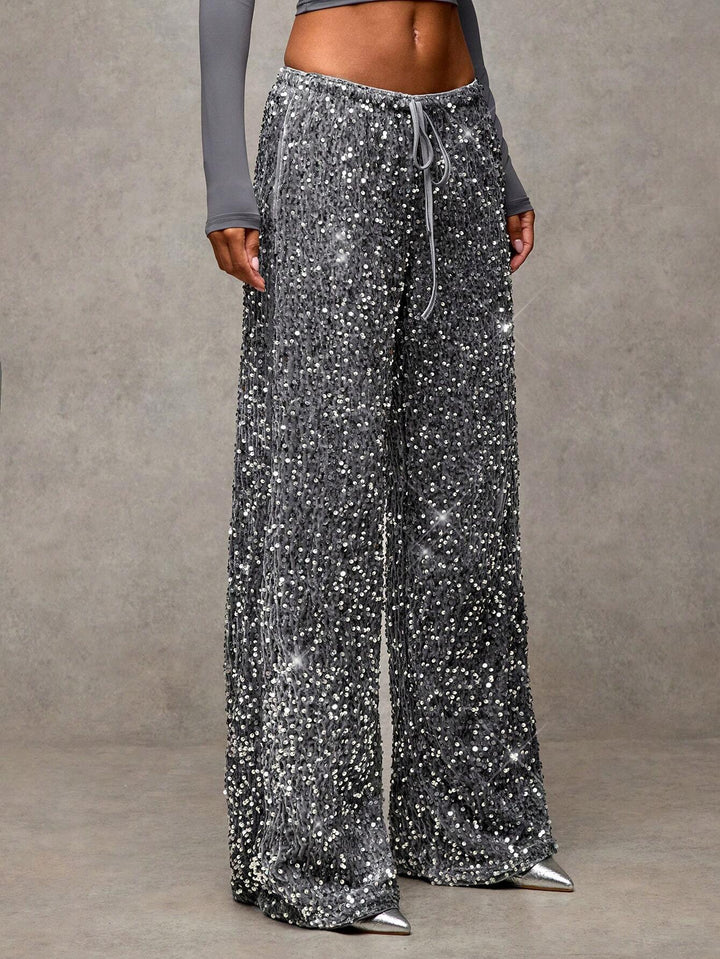 Sorvienne Relaxed Drawstring Wide Leg Sequin Trousers in Silver