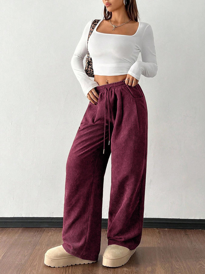Sorvienne Relaxed Drawstring Wide Leg Cord Trousers in Plum