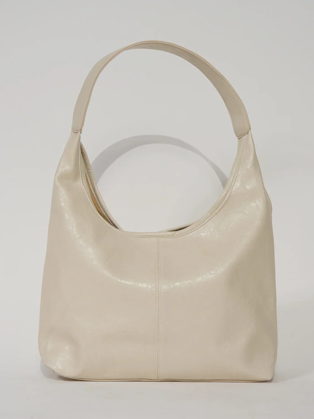 Sorvienne Slouchy Glossy Faux Leather Shoulder Bag in Cream