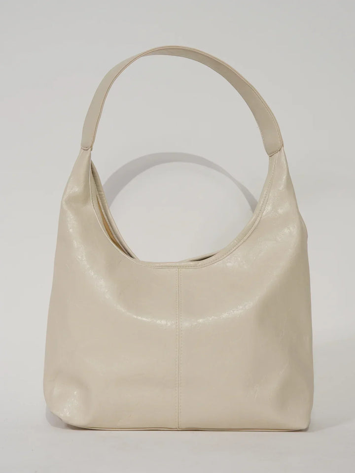 Sorvienne Slouchy Glossy Faux Leather Shoulder Bag in Cream