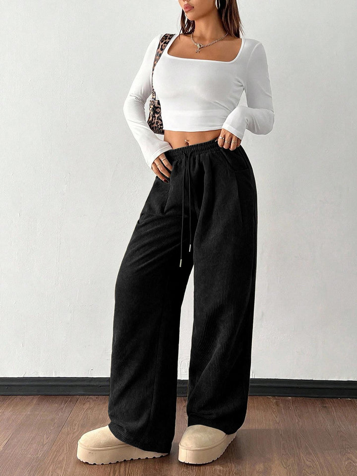 Sorvienne Relaxed Drawstring Wide Leg Cord Trousers in Black