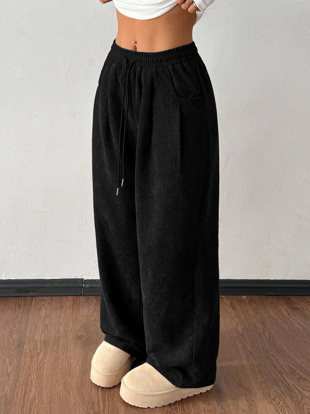 Sorvienne Relaxed Drawstring Wide Leg Cord Trousers in Black