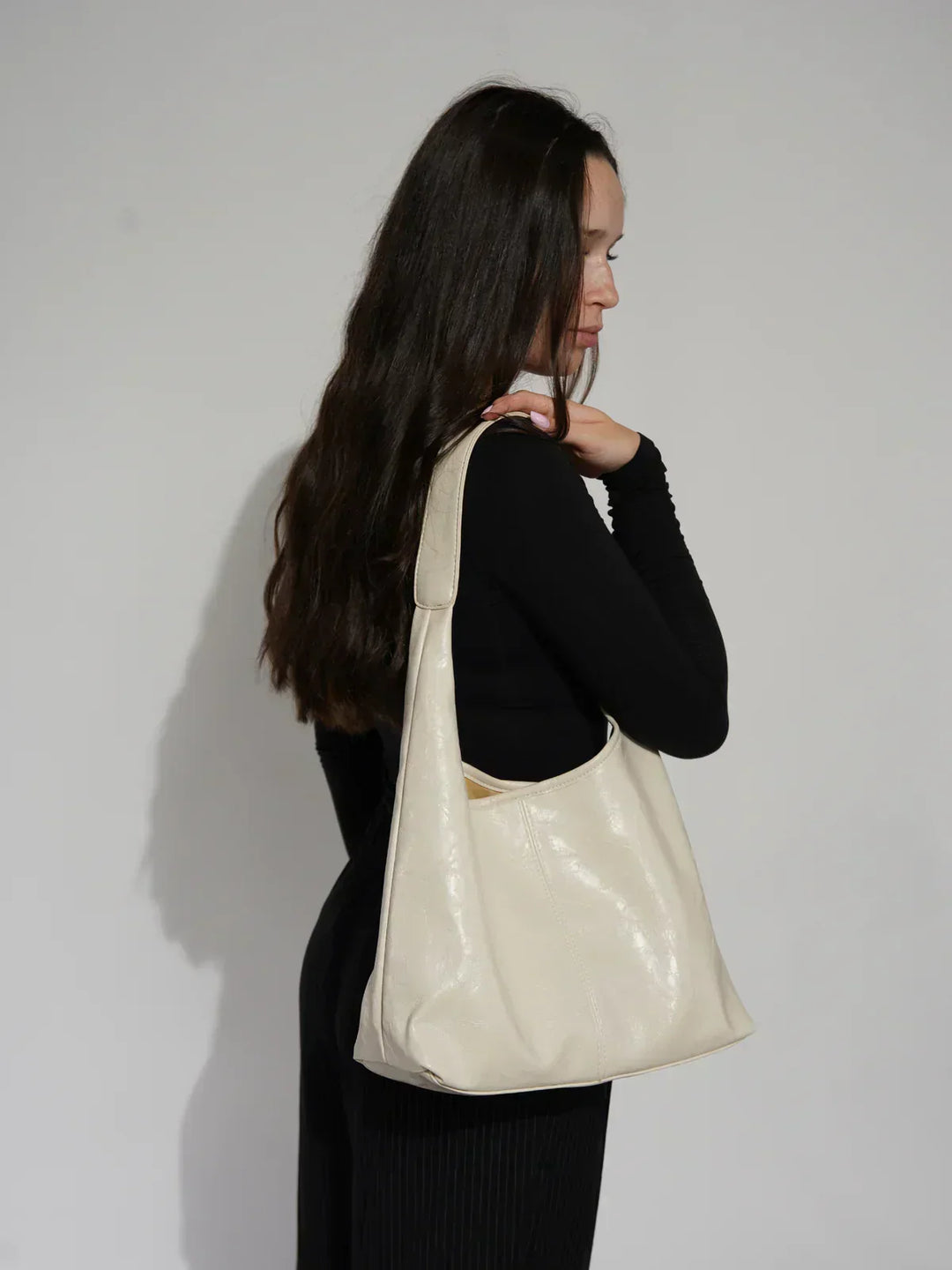 Sorvienne Slouchy Glossy Faux Leather Shoulder Bag in Cream