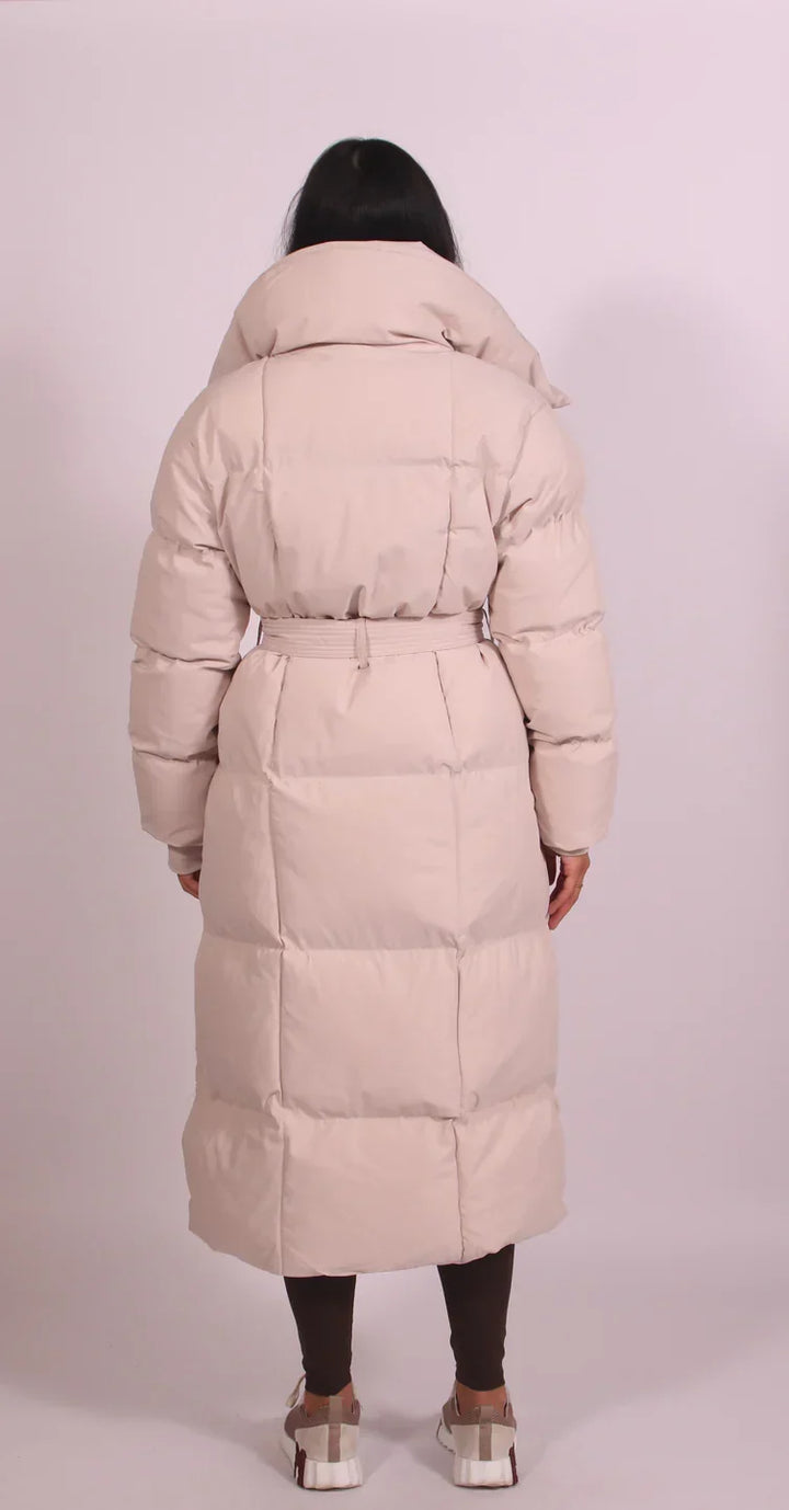 Sorvienne Belted Maxi Puffer Coat in Beige