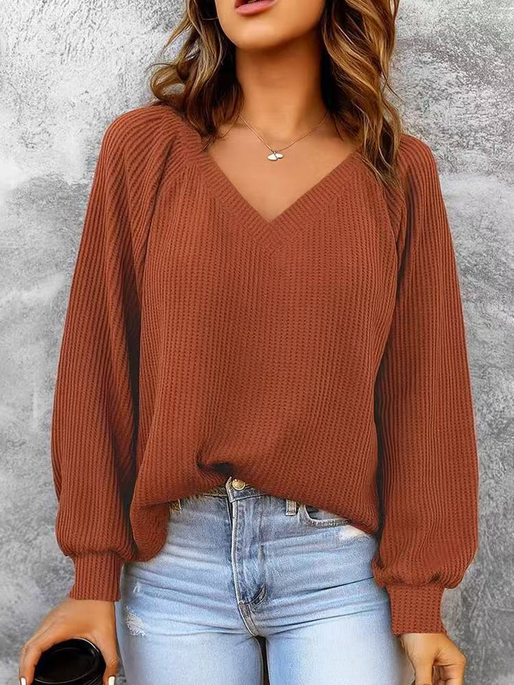Sorvienne Relaxed Raglan Rib V Neck Jumper in Rust