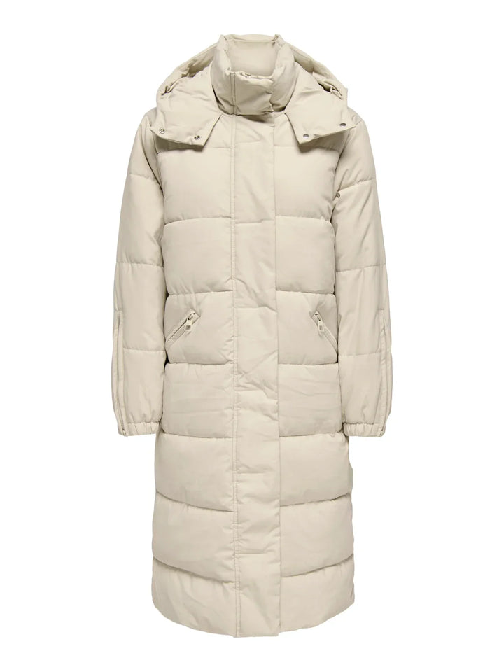 Sorvienne Hooded Longline Puffer Coat in Cream