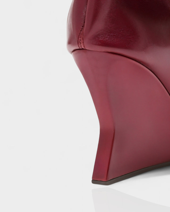Sorvienne Pointed Toe Wedge Heel Slouch Boots in Burgundy